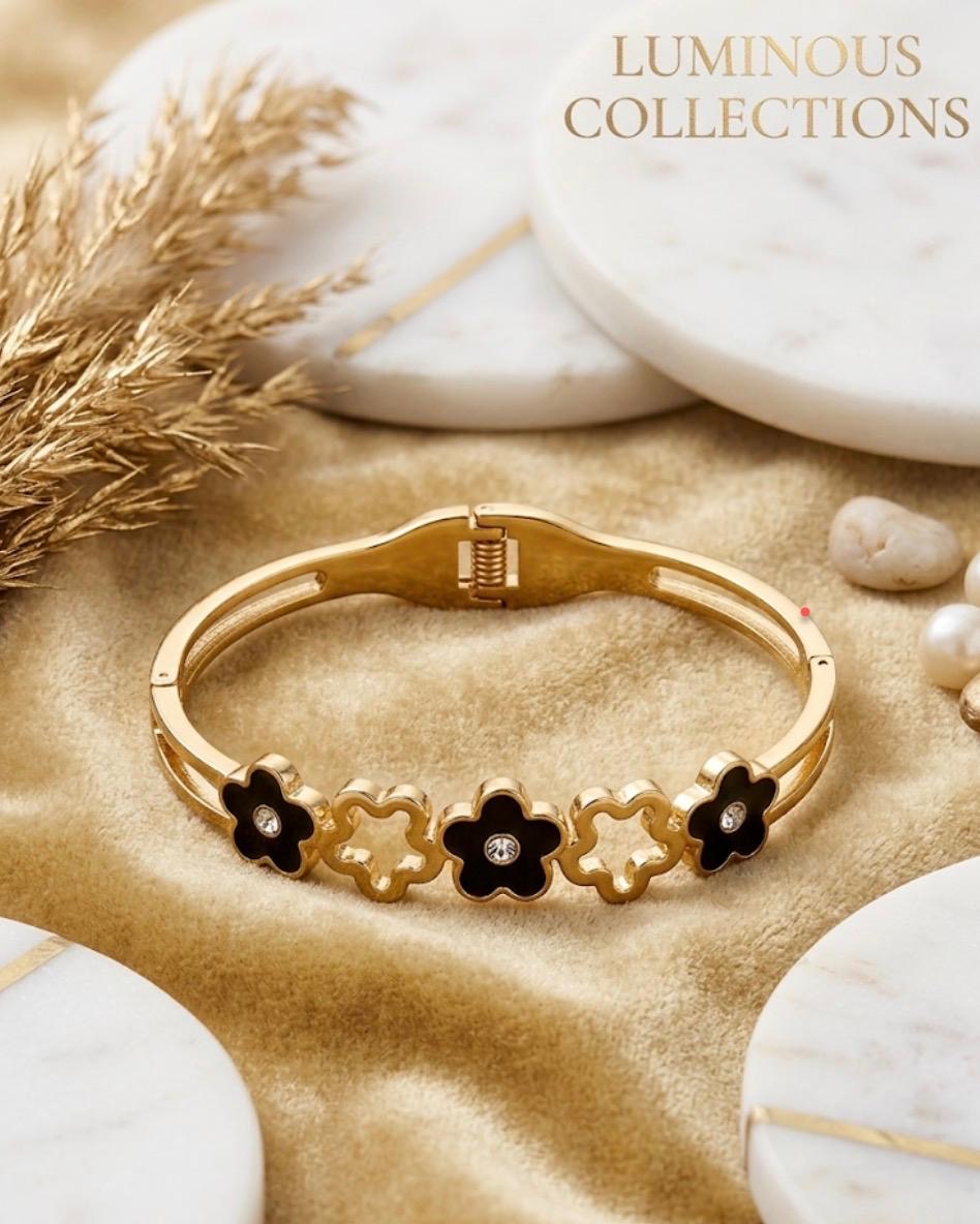 #LC1136 gold-plated bangle bracelet featuring a black floral design