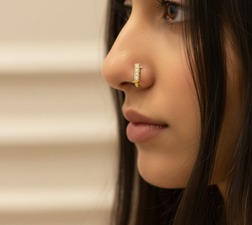 #LC1148 gold tone nose hugger hoop featuring a row of small stones